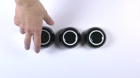 Three beaker game Stock Footage 24637822