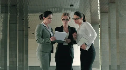 Three beautiful professionals discussing their working day Stock Footage