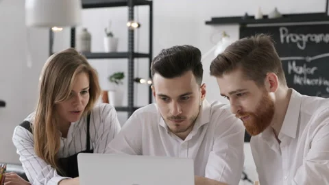 Three beautiful trendy persons start up financial solution in bright boardroom o Stock Footage 199475594