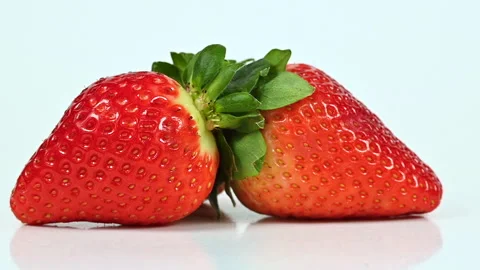 Three big red ripe strawberries macro closeup Stock Footage 301448189