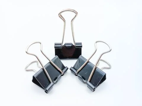 Three Binder Clips With Various Handle Position Isolated On White Background Photos