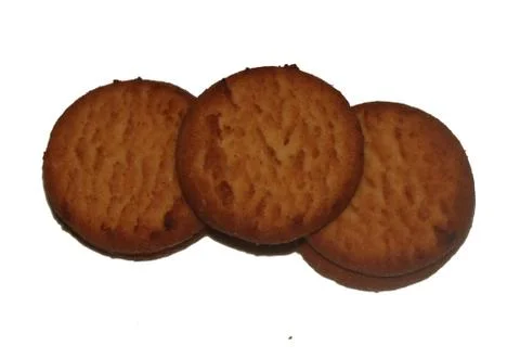 Three biscuits of brown color Stock Photos