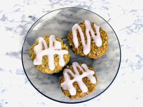 Three biscuits on a plate Stock Photos