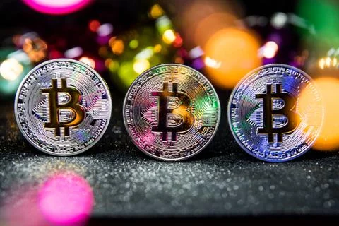 Three Bitcoins,  (BTC) a cryptocurrency Stock Photos