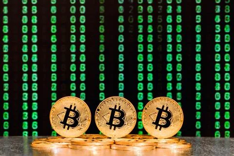 Three bitcoins with numbers in backgrounds Foto stock