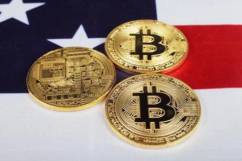 Three bitcoins on the usa flag, selective focus. Stock Photos