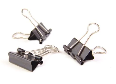 Three black clips on white background Foto stock