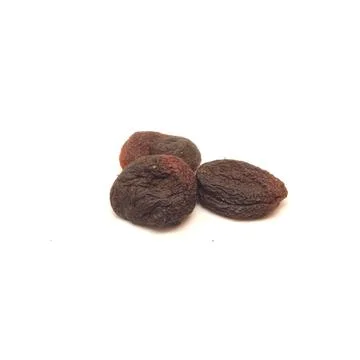 Three black dried apricots isolated on white background. Stock Photos