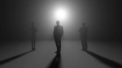 Three black silhouettes on a black background Stock Footage 296921440