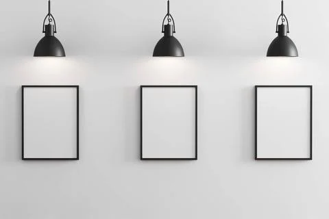 Three black vertical frames mockup with black pendant lights above and whi... Foto stock