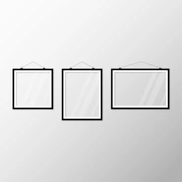 Three black white picture frames hanging on the wall Stock Illustration
