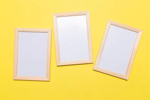 Three blank frame on a yellow background. concept Stock Photos