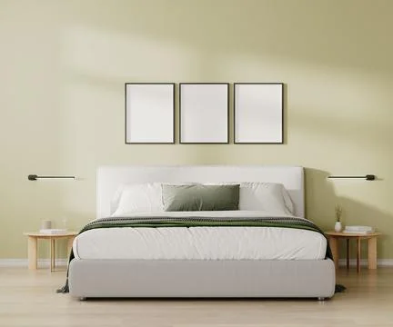 Three blank frames mock up above bed in bedroom interior in light green tone, Stock Illustration