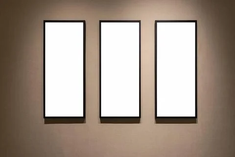 Three blank frames on a wall with wallpaper three blank frames on a wall w... Stock Photos