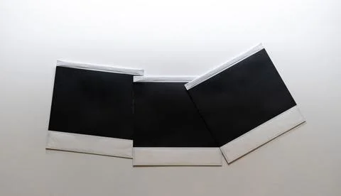 Three blank retro photo frames on white background. Photos