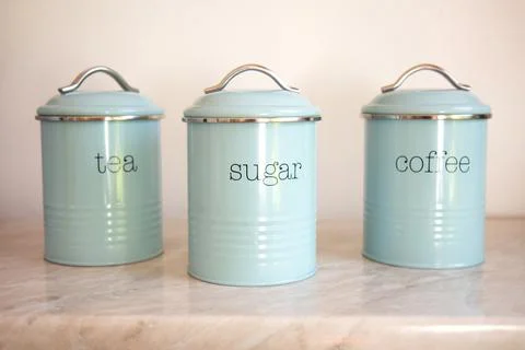Three blank round kitchen containers on light background Stock Photos