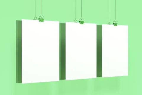 Three blank white posters with binder clip mockup on green background Stock Illustration