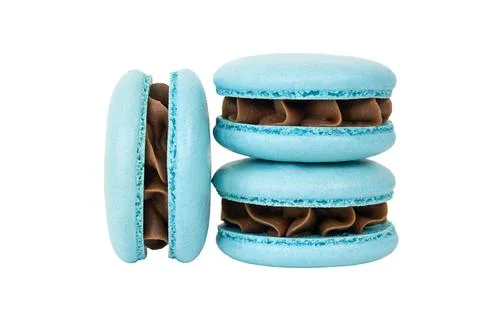 Three blue macarons with chocolate cream isolated on white Stock Photos