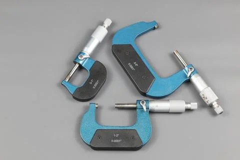 Three blue micrometers with various sizes Stock Photos