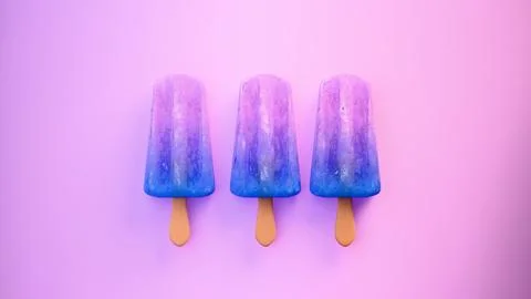 Three blue popsicles on purple background.... Foto stock