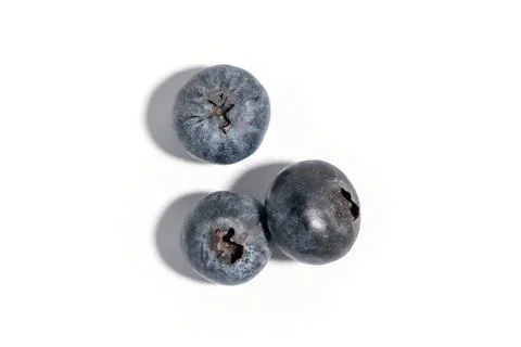 Three blueberries on a white background Stock Photos