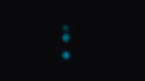 Three blurred blue circular light spots set against a solid black background Stock-Footage 339618282