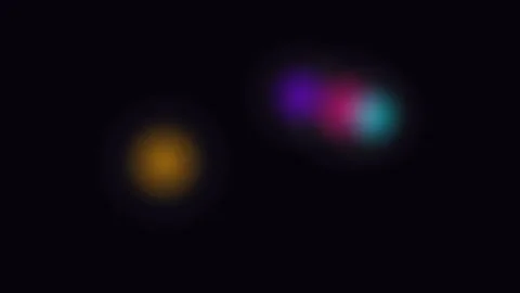 Three blurred glowing orbs of vibrant purple pink and gold on black backgroun Video stock 338311991