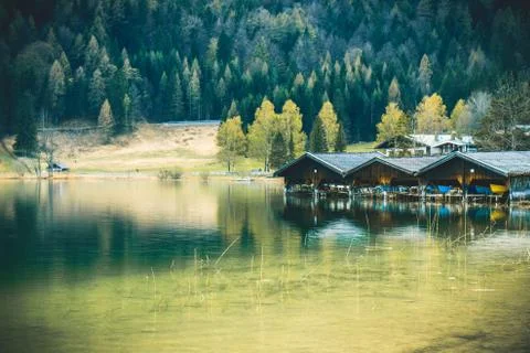 Three Boathouses at a lake Stock Photos