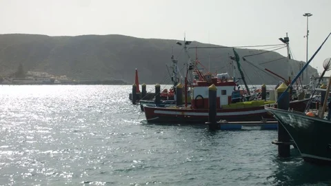 Three Boats Moored to the Jetty. The Sun is Shining Stock Footage 75915415