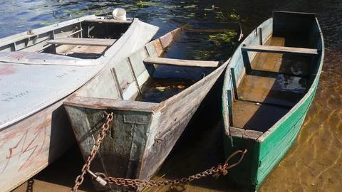 Three boats on the river Stock Photos