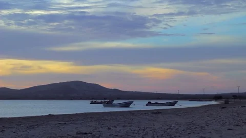 Three boats on seashore at sunset Vídeos de archivo 75167158