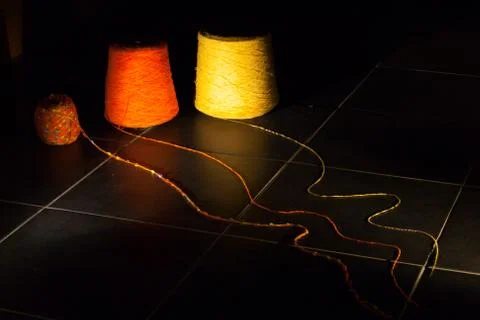 Three bobbins of coloured thread Stock Photos