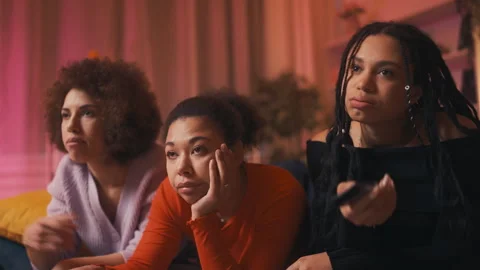 Three bored young women watching a dull ... | Stock Video | Pond5