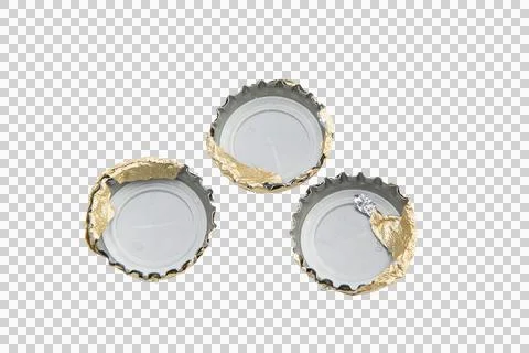 Three bottle caps, each with torn golden foil Stock Photos