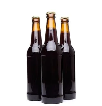 Three bottles of beer on white background. Stock Photos
