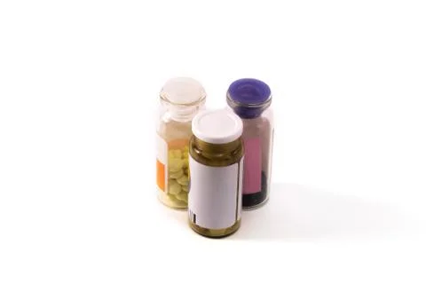 Three bottles of pills Stock Photos