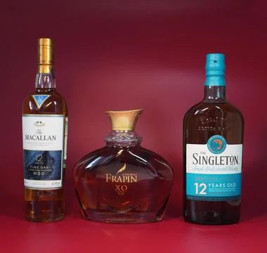 Three bottles on a red background Stock Photos