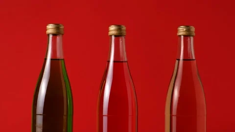 Three bottles of red, yellow, and green liquid. The camera dolly Stock-Footage 149277602