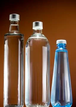 Three bottles of various capacities with fresh drinking water Stock Photos