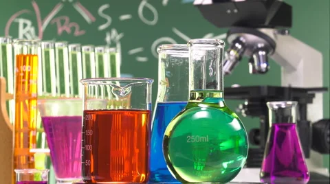 Three bottles of various shapes and colors on a turntable Video stock 64290996