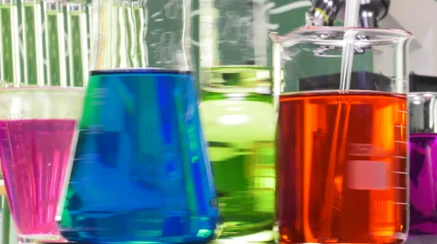 Three bottles of various shapes and colors on a turntable Video stock 64292525
