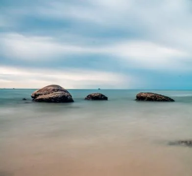 Three boulders in the water Foto stock