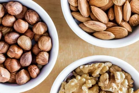 Three bowls of assorted nuts Stock Photos