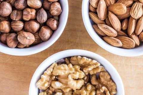 Three bowls of assorted nuts Foto stock