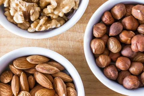 Three bowls of assorted nuts Foto stock
