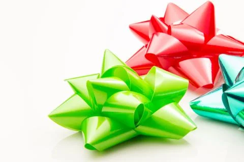 Three bows for presents on a white background. Stock Photos