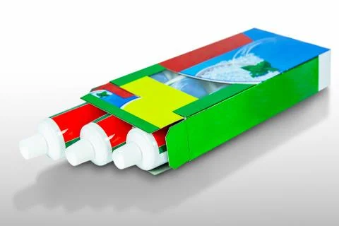 Three boxes of toothpaste pack size isolated on white background Foto stock