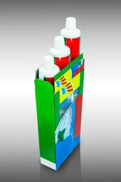 Three boxes of toothpaste pack size isolated on white background Stock Photos