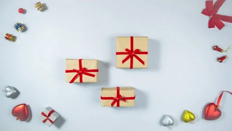 Three boxes wrapped in craft paper and t... | Stock Video | Pond5