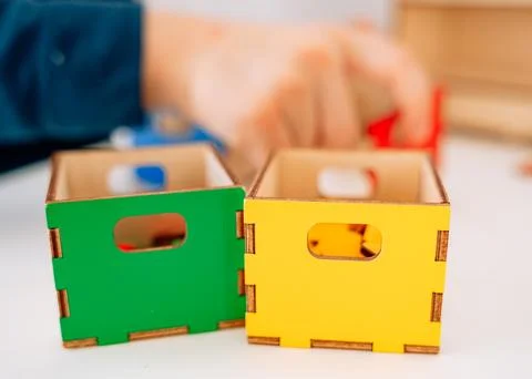 Three boxes: yellow and blue with geometric shapes of different colors. A Stock Photos